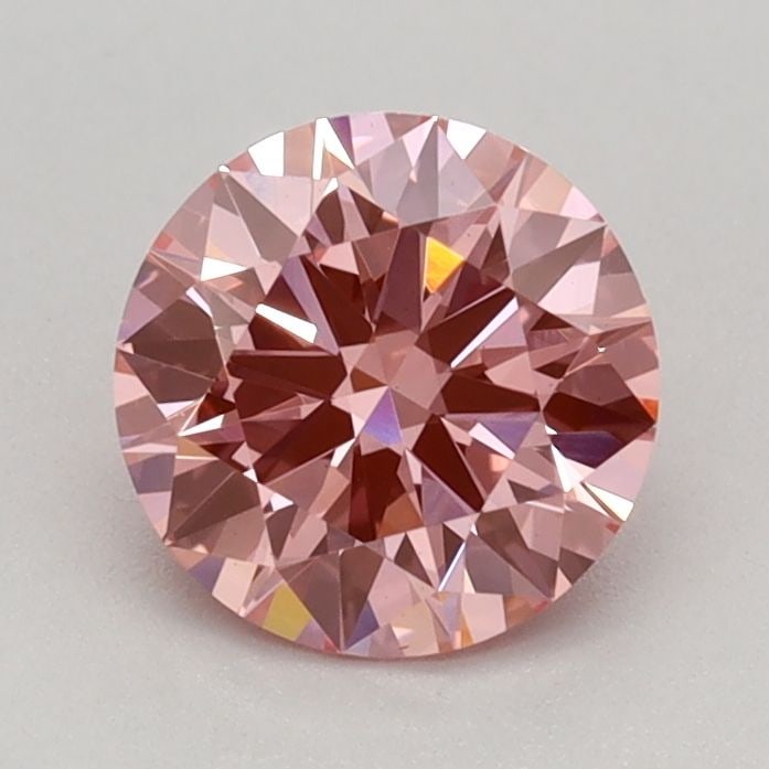 Ideal Loose Diamond - ROUND 0.75ct Fancy Vivid Pink VS1: Ideal Loose Diamond - ROUND 0.75ct Fancy Vivid Pink VS1 Source: This is a real non-mined Diamond that has been grown in a lab Shape: ROUND Carats: 0.75 Color: Fancy Vivid Pink Certification: IGI Video