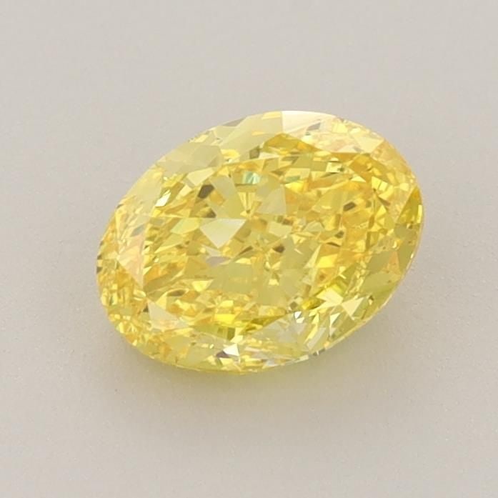 Loose Diamond - OVAL 0.9ct Fancy Vivid Yellow VS2: Loose Diamond - OVAL 0.9ct Fancy Vivid Yellow VS2 Source: This is a real non-mined Diamond that has been grown in a lab Shape: OVAL Carats: 0.9 Color: Fancy Vivid Yellow Certification: IGI Video: