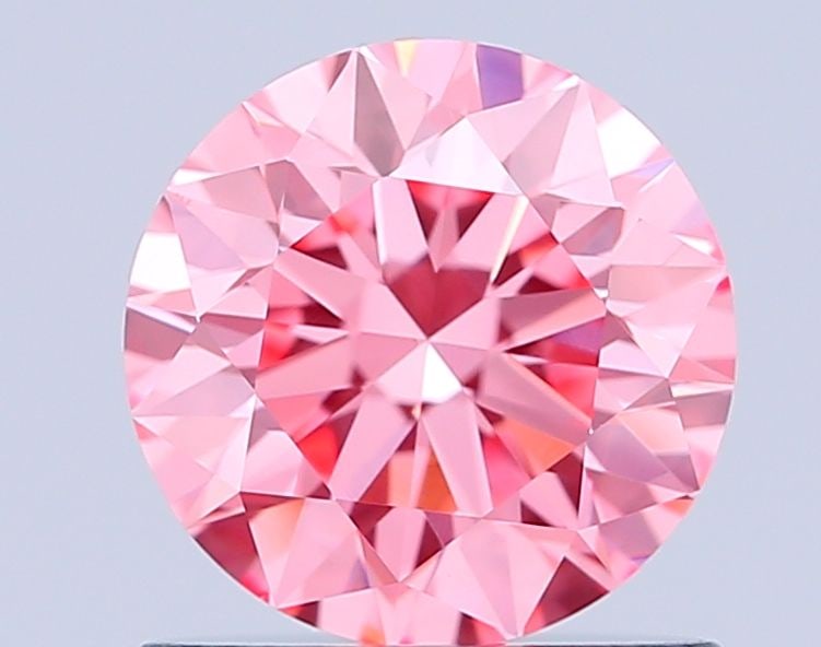 Ideal Loose Diamond - ROUND 0.9ct Fancy Vivid Pink VS1: Ideal Loose Diamond - ROUND 0.9ct Fancy Vivid Pink VS1 Source: This is a real non-mined Diamond that has been grown in a lab Shape: ROUND Carats: 0.9 Color: Fancy Vivid Pink Certification: IGI Video: