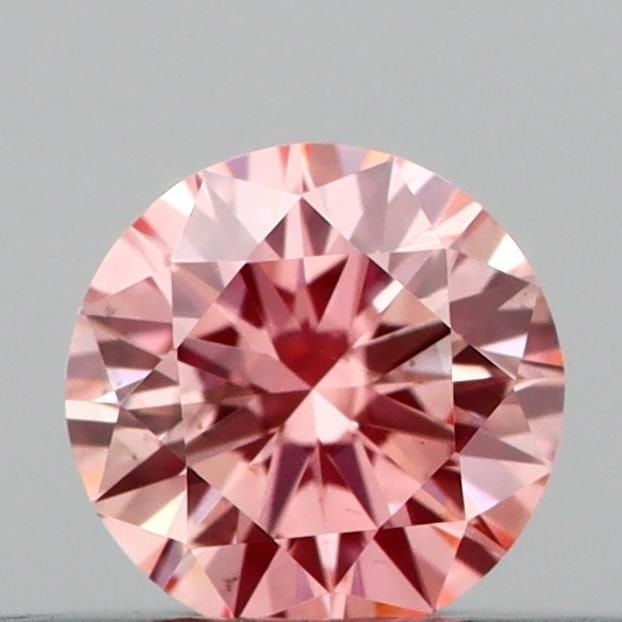Loose Diamond - ROUND 0.2ct Fancy Vivid Pink VS2: Loose Diamond - ROUND 0.2ct Fancy Vivid Pink VS2 Source: This is a real non-mined Diamond that has been grown in a lab Shape: ROUND Carats: 0.2 Color: Fancy Vivid Pink Certification: IGI Video: