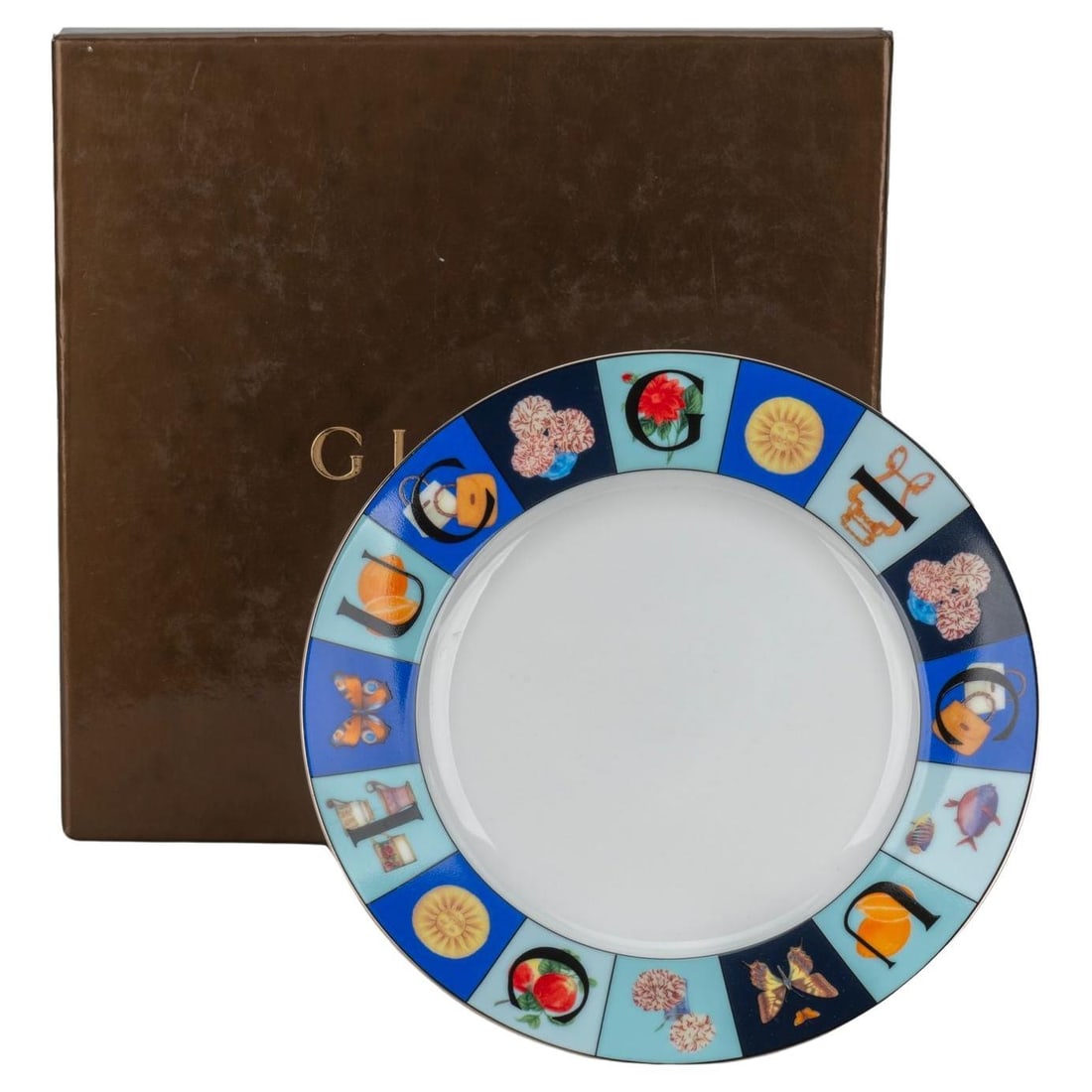 Gucci Multicolor Porcelain Dessert Dish with Gift Box: Gucci Multicolor Porcelain Dessert Dish with Gift Box This exquisite Gucci dessert dish features a vibrant multicolor design, perfect for adding a touch of elegance to your table setting. Crafted from