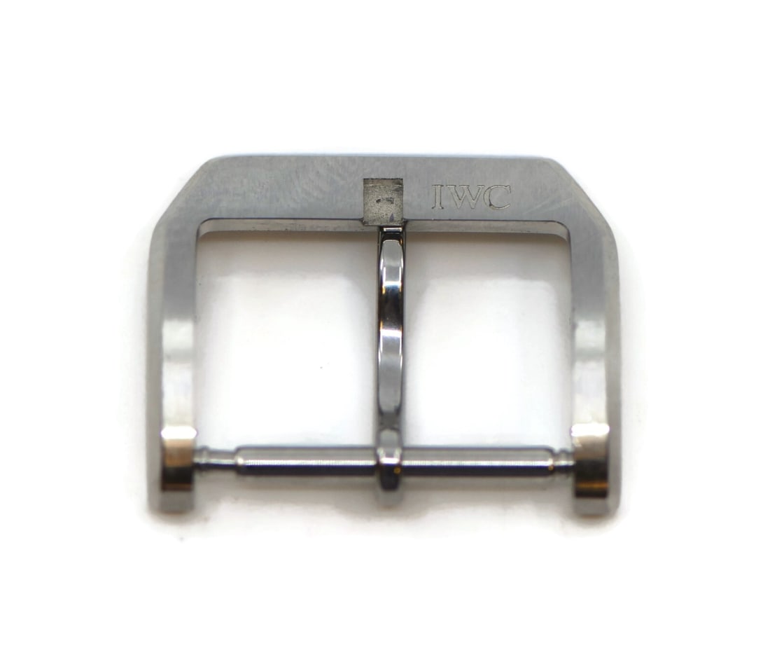 IWC Authentic Stainless Steel 18mm Tang Buckle for Wristwatch: IWC Authentic Stainless Steel 18mm Tang Buckle for Wristwatch This authentic IWC stainless steel tang buckle is designed specifically for wristwatch bands with an 18 mm width. Crafted from high-qualit