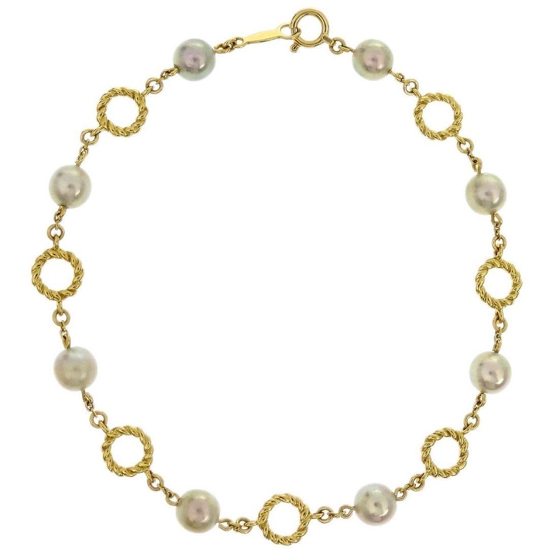 Vintage Mikimoto 18K Gold Bracelet with Pearls: Vintage Mikimoto 18K Gold Bracelet with Pearls This exquisite bracelet from Mikimoto showcases the perfect blend of elegance and luxury. Crafted from 18K gold, this vintage piece features lustrous pea