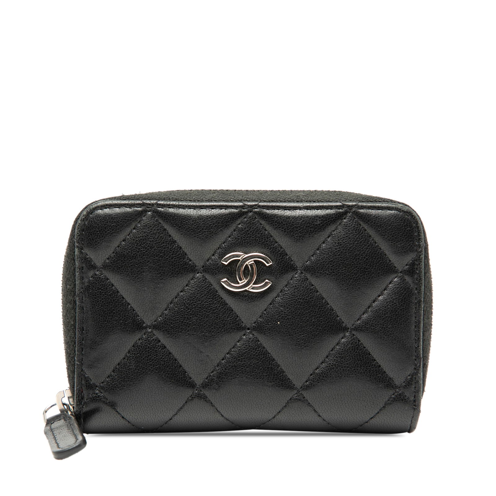 Black Lambskin Quilted Coin Purse by Chanel with Zip Closure: Black Lambskin Quilted Coin Purse by Chanel with Zip Closure This Chanel CC Quilted Lambskin Zip Coin Pouch features a quilted leather exterior in black, a zip-around closure, an exterior back slip po