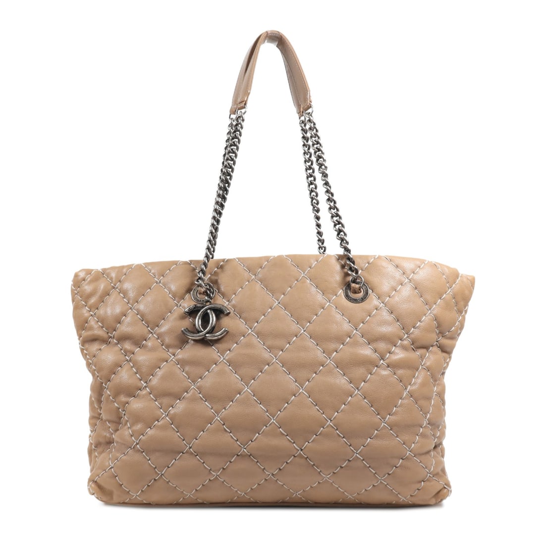 CHANEL Beige Calfskin Leather CC Shoulder Tote Bag: CHANEL Beige Calfskin Leather CC Shoulder Tote Bag This stunning CHANEL Tote Bag is crafted from high-quality calfskin leather, offering a luxurious touch and durability. The elegant beige color adds
