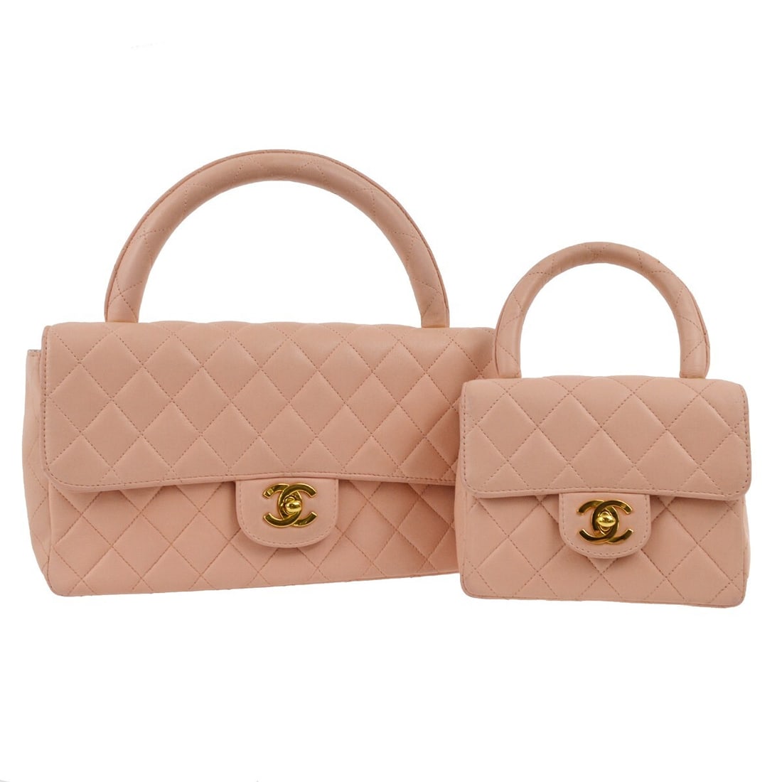 Chanel Pink Lambskin Classic Single Flap Handbag 2 in 1 Set: Chanel Pink Lambskin Classic Single Flap Handbag 2 in 1 Set This exquisite Chanel handbag set features a stunning pink lambskin exterior with a quilted design. The classic single flap style is both el