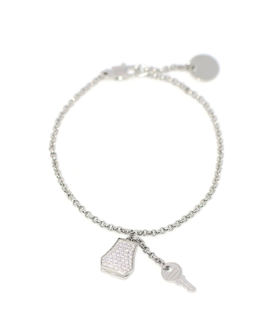 Hermes Kelly Clochette 18K White Gold Diamond Bracelet 7 Inch: Hermes Kelly Clochette 18K White Gold Diamond Bracelet 7 Inch Elevate your accessory collection with this exquisite Hermes Kelly Clochette Bracelet. Crafted from luxurious 18K white gold, this chain-s