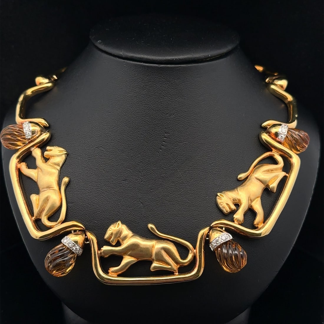 18k Yellow Gold Panther Necklace with Citrine and Diamond Accents: 18k Yellow Gold Panther Necklace with Citrine and Diamond Accents This exquisite 18k Yellow Gold Carved Citrine & Diamond Dual Finish Panther Station Necklace features a stunning design perfect for an