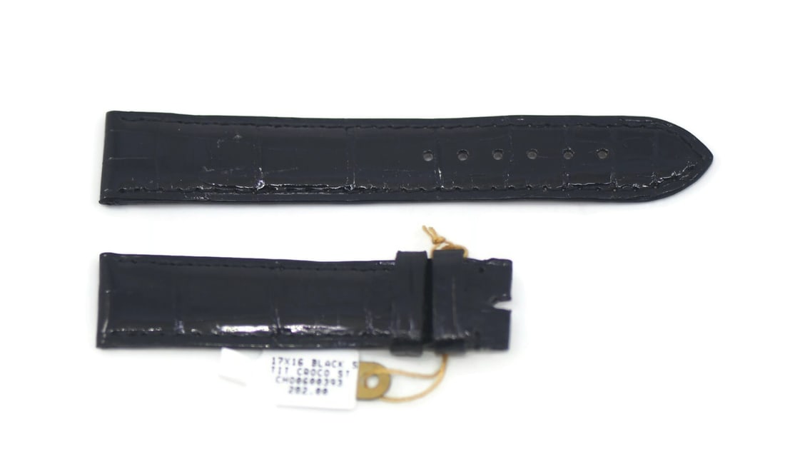 Chopard Black Leather Wristwatch Band 17mm Authentic Replacement: Chopard Black Leather Wristwatch Band 17mm Authentic Replacement This Chopard wristwatch band is crafted from high-quality black leather, offering both durability and style. With a band width of 17 mm