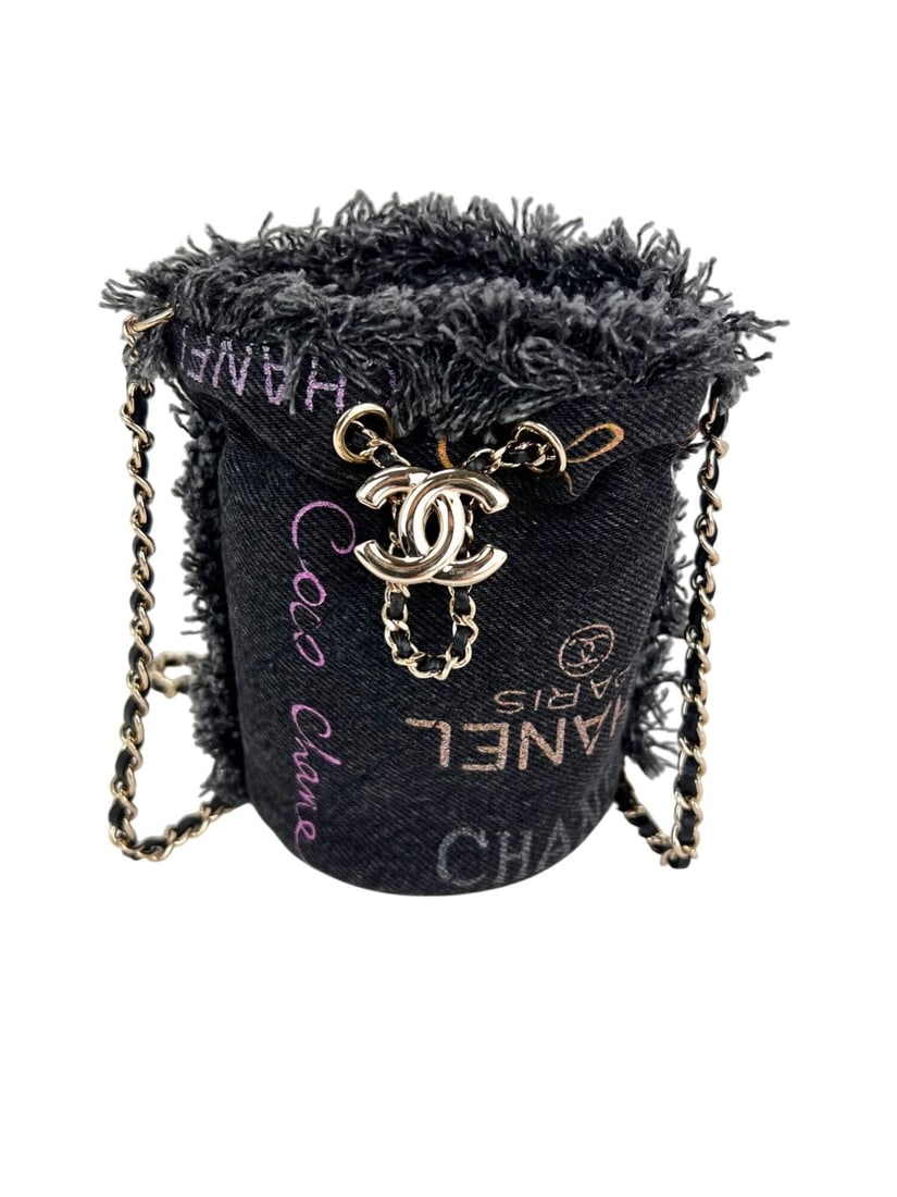 Chanel Mini Mood Bucket Bag Black Denim Chain Quilted: Chanel Mini Mood Bucket Bag Black Denim Chain Quilted This Chanel Mini Bucket Bag in black denim features a unique quilted finish that exudes sophistication and style. With a round shape and a drawstr