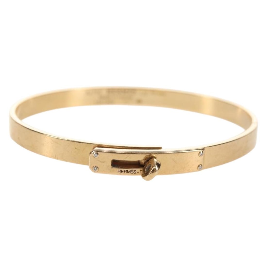 HERMES Kelly PM Diamond Bracelet 18K Gold Auth 143058SM: HERMES Kelly PM Diamond Bracelet 18K Gold Auth 143058SM This HERMES Kelly Bracelet PM features a stunning design crafted in 18K gold, showcasing a beautiful diamond accent. The bracelet, made in Franc