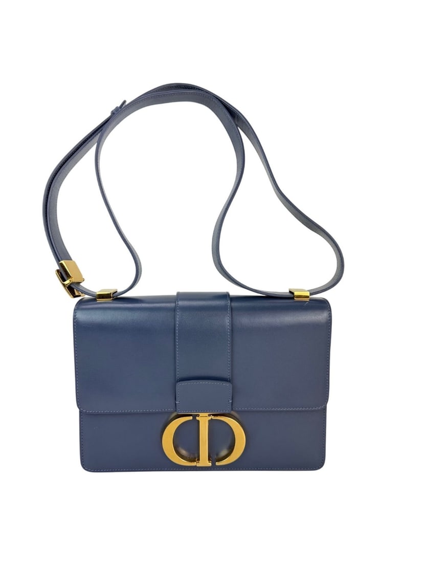 Christian Dior 30 Montaigne Dark Denim Calfskin Crossbody Bag: Christian Dior 30 Montaigne Dark Denim Calfskin Crossbody Bag Introducing the Christian Dior 30 Montaigne Smooth Calfskin Box Bag in a stunning dark denim hue. This medium-sized crossbody bag features