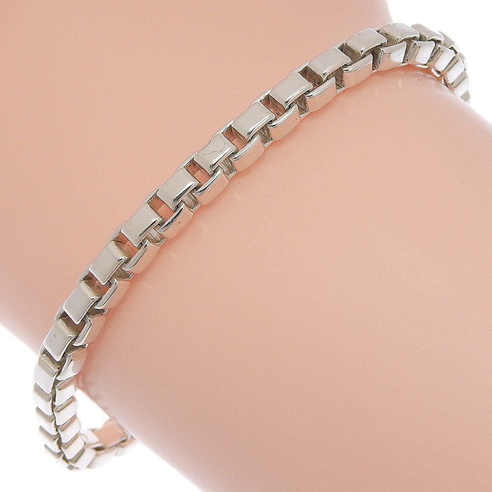 Venetian Link Silver Bracelet by Tiffany & Co.: Venetian Link Silver Bracelet by Tiffany & Co. This Tiffany & Co. Venetian Link bracelet is crafted in silver and designed for women. The bracelet is a pre-owned item in excellent condition, with mini