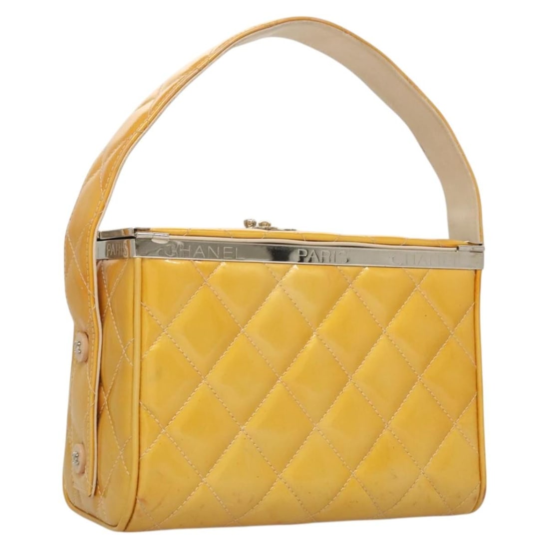 Yellow Vintage Metal Box Handbag by Chanel: Yellow Vintage Metal Box Handbag by Chanel This Chanel vintage metal box bag features a yellow exterior with notable signs of use, including rubbing, stains, sun exposure, and minor loss of shape. The