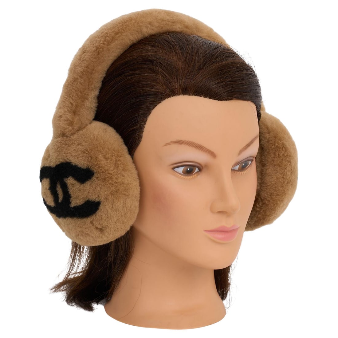 Chanel Caramel Shearling Earmuffs with CC Logo: Chanel Caramel Shearling Earmuffs with CC Logo Discover the luxury of warmth with these Chanel earmuffs, crafted from soft shearling in a chic caramel and black color scheme. Each earmuff features the