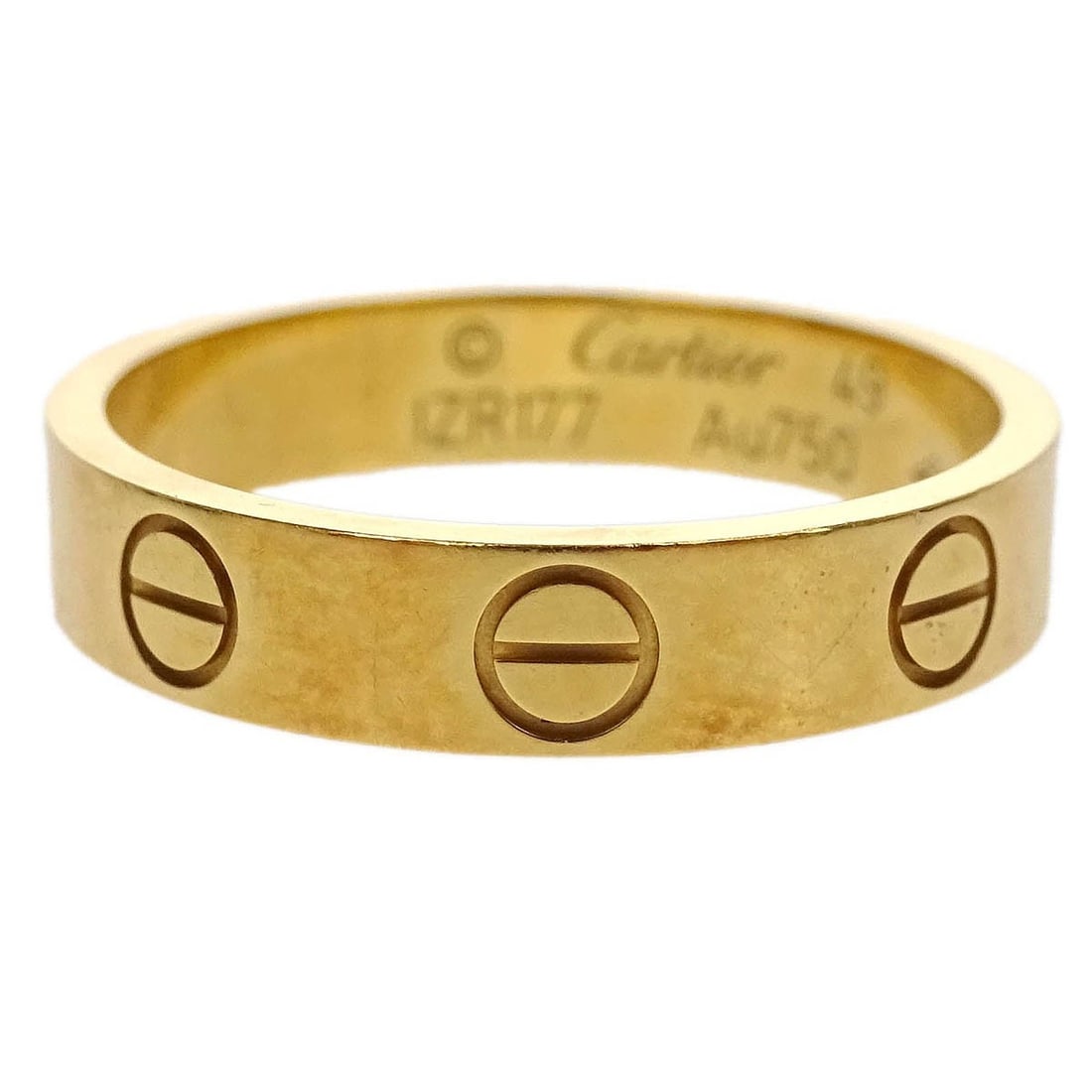 Gold Love Band Ring by Cartier for Women: Gold Love Band Ring by Cartier for Women This Cartier Love wedding band ring is crafted in gold and is designed for women. It is in very good condition, reflecting minimal signs of wear. The classic d
