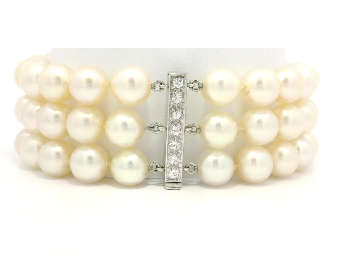 Vintage 3 Strand Pearl Bracelet with Diamond White Gold Bars: Vintage 3 Strand Pearl Bracelet with Diamond White Gold Bars This exquisite vintage 3-strand pearl bracelet features a stunning combination of natural white pearls and diamonds, elegantly crafted with