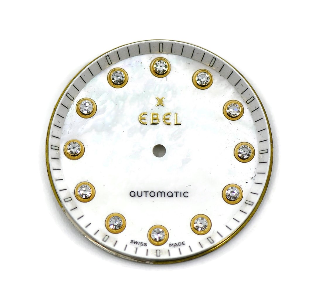 Mother of Pearl Diamond Accent Dial for Ebel 28mm: Mother of Pearl Diamond Accent Dial for Ebel 28mm This is a pre-owned Ebel watch dial crafted from mother of pearl and accented with diamonds. The dial is designed for Ebel timepieces and measures 28m