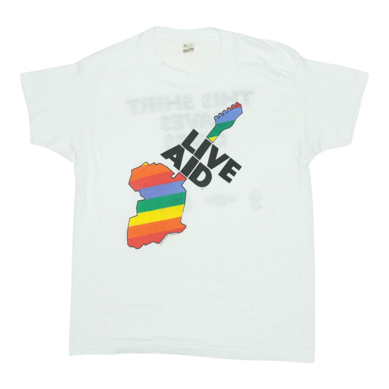 1985 Live Aid Vintage This Shirt Saves Lives Tee: 1985 Live Aid Vintage This Shirt Saves Lives Tee Discover this authentic vintage 1985 Live Aid 'This Shirt Saves Lives' shirt, a true piece of music history. This shirt features captivating front and