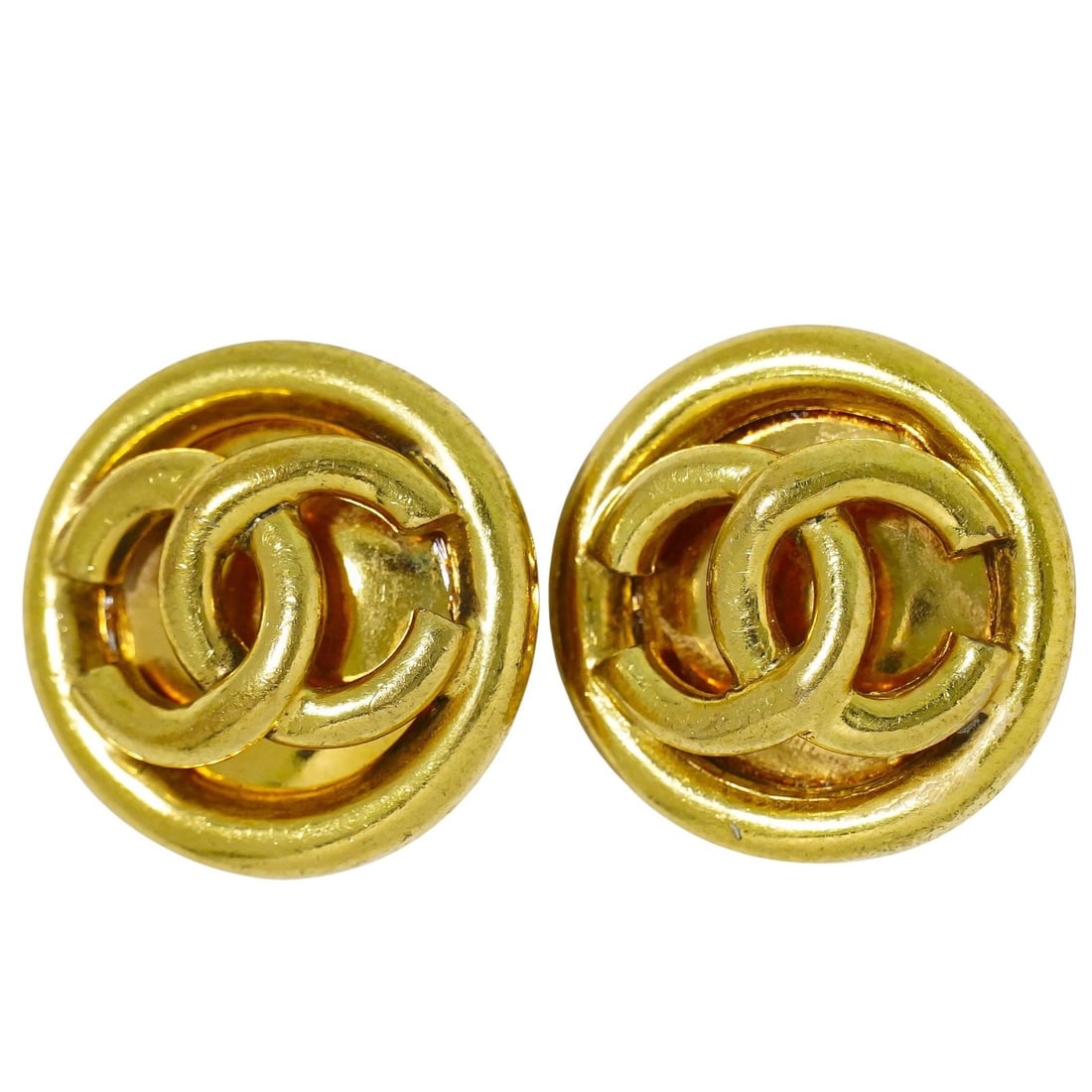 Round Clip-On Earrings by Chanel with CC Logo Gold Tone Vintage: Round Clip-On Earrings by Chanel with CC Logo Gold Tone Vintage These vintage Chanel round CC clip-on earrings feature a classic gold finish and are designed for women. The earrings are pre-owned and