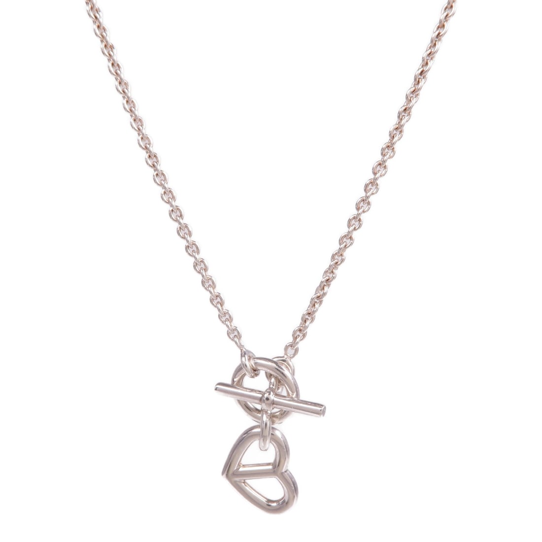 Sterling Silver 925 Amulette Pendant Necklace from Hermes Cache Coeur Collection: Sterling Silver 925 Amulette Pendant Necklace from Hermes Cache Coeur Collection This Hermes Cache Coeur Amulette pendant necklace is crafted from 925 sterling silver and features a stylish, minimalis