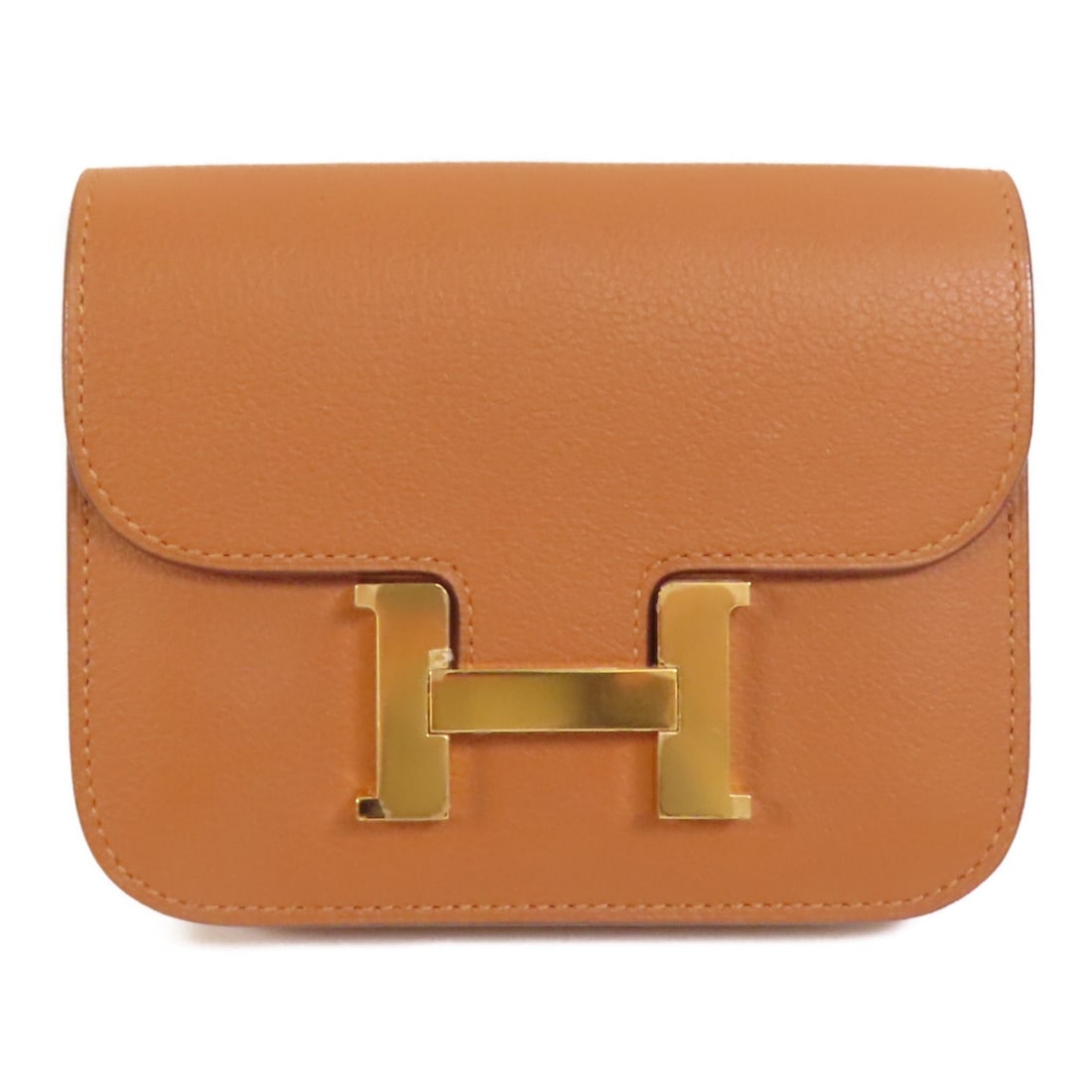 Constance Slim Bicolor Round Wallet by Hermes in Evercolor Leather with Gold Hardware: Constance Slim Bicolor Round Wallet by Hermes in Evercolor Leather with Gold Hardware This Hermes Constance Slim Bicolor wallet is crafted from Evercolor calfskin leather in a brown hue. It features a