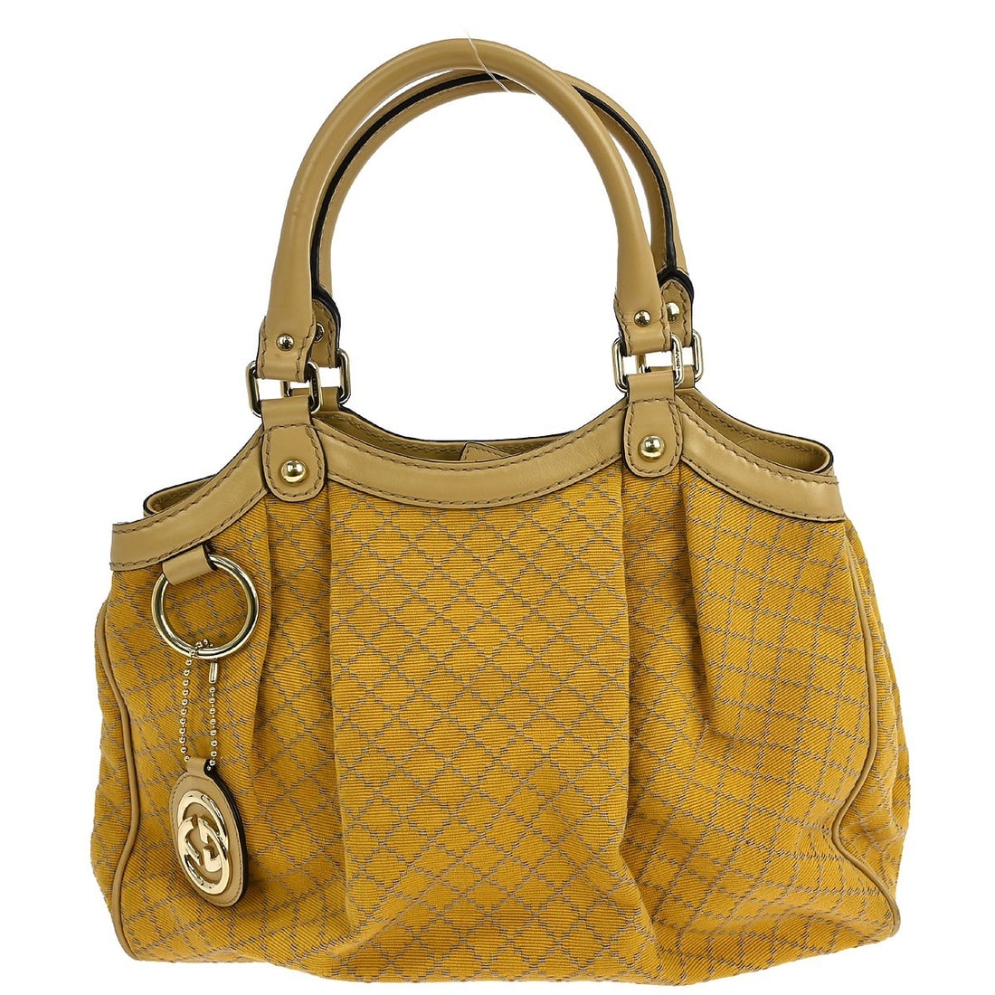 Sukey Tote Bag by Gucci in Beige Canvas: Sukey Tote Bag by Gucci in Beige Canvas This pre-owned Gucci Sukey tote bag features a beige canvas exterior and is designed for female use. The bag shows signs of use, including scuffs on the canvas
