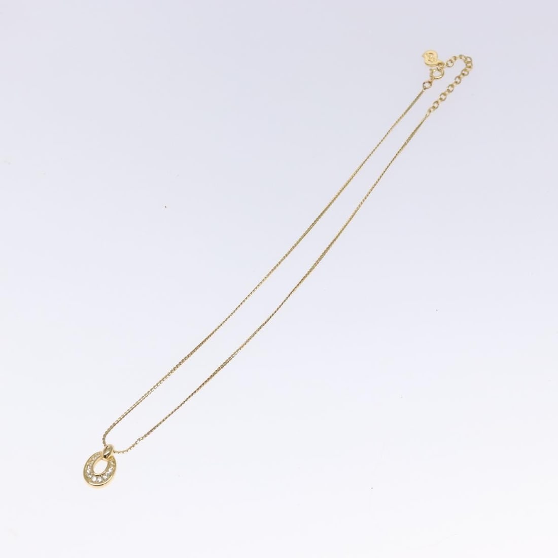 Dior Gold Tone Choker Necklace for Women: Dior Gold Tone Choker Necklace for Women This Christian Dior collar necklace features a gold-tone finish and is designed for women. The piece exhibits slight scratches on the exterior surface and part