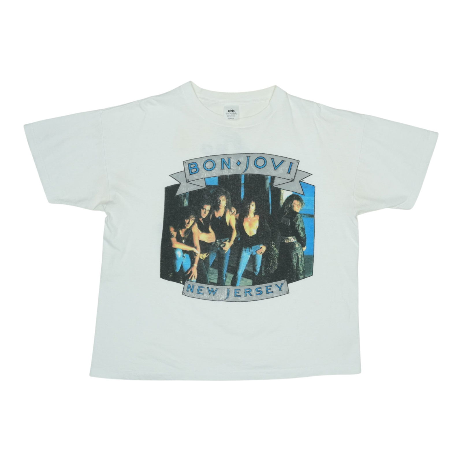 Vintage 1980s Bon Jovi Jersey Syndicate Shirt White: Vintage 1980s Bon Jovi Jersey Syndicate Shirt White Step back into the vibrant 1980s with this original vintage Bon Jovi Jersey Syndicate Shirt. This authentic piece features striking front and back g