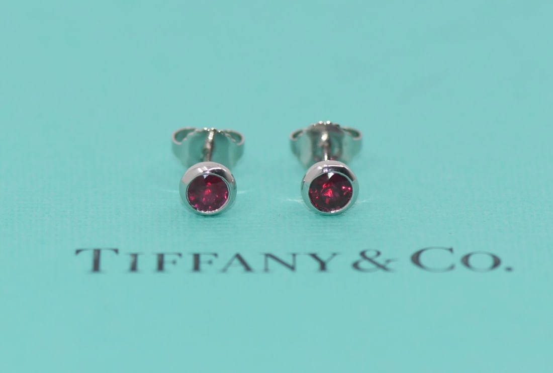 Elsa Peretti Platinum Stud Earrings with Rubies by Tiffany & Co: Elsa Peretti Platinum Stud Earrings with Rubies by Tiffany & Co These Tiffany & Co. Elsa Peretti stud earrings feature rubies set in platinum with a metal purity of 950. Measuring 5.6mm and weighing 2