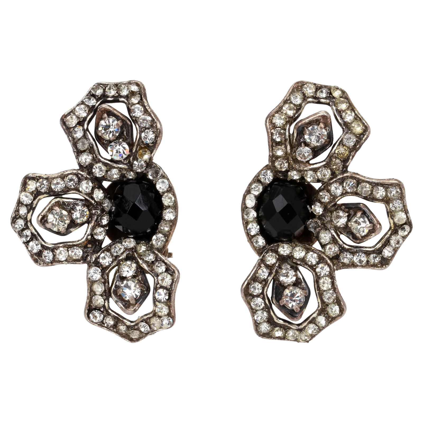 1996 Chanel Floral Rhinestone Earrings with Black Stones: 1996 Chanel Floral Rhinestone Earrings with Black Stones These exquisite 1990's Chanel Floral Rhinestone Earrings feature a stunning floral motif, highlighted by a central black stone surrounded by th