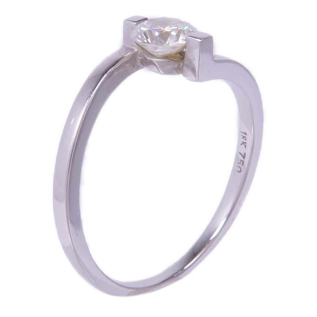 Diamond Ring in 18K White Gold US Size 8 by JEWELRY: Diamond Ring in 18K White Gold US Size 8 by JEWELRY This exquisite diamond ring is crafted from 18K white gold, featuring a stunning clear diamond at its center. With a size of US #8, it offers a perf