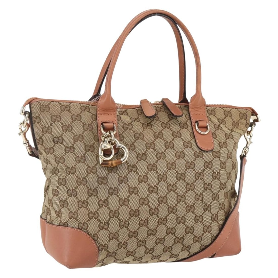 Brown Vintage Gucci Tote Bag with Shoulder Strap: Brown Vintage Gucci Tote Bag with Shoulder Strap This pre-owned Gucci vintage tote bag is crafted in brown material and is designed for female use. The bag shows significant signs of wear, including l