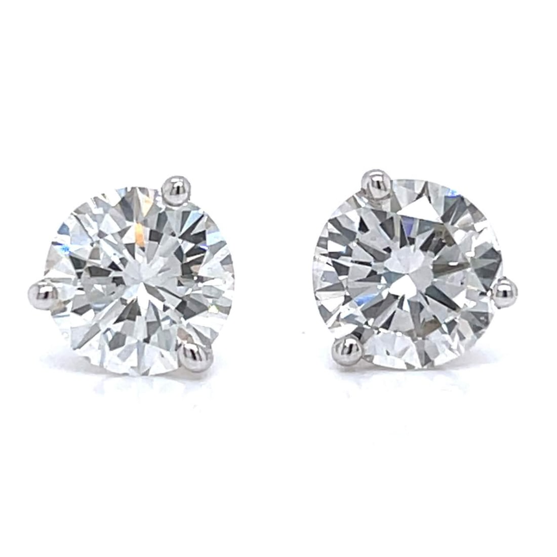 14K White Gold GIA Certified 3.45 Ct Diamond Stud Earrings: 14K White Gold GIA Certified 3.45 Ct Diamond Stud Earrings Elevate your elegance with these stunning 14K White Gold Diamond Stud Earrings. Each earring features a GIA Certified diamond, one weighing 1
