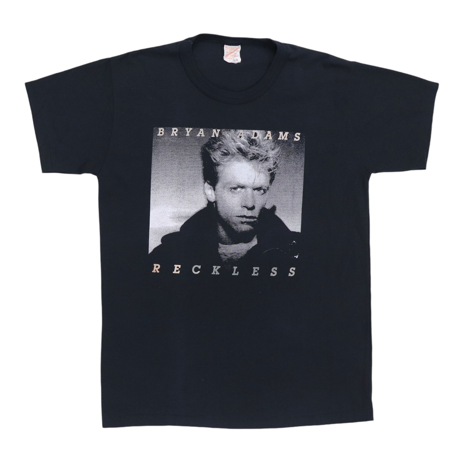 Vintage 1984 Bryan Adams Reckless Black Shirt 50/50 Blend: Vintage 1984 Bryan Adams Reckless Black Shirt 50/50 Blend This original vintage 1984 Bryan Adams Reckless Shirt is a true collector's item, showcasing the iconic style of the 1980s. Crafted from a com