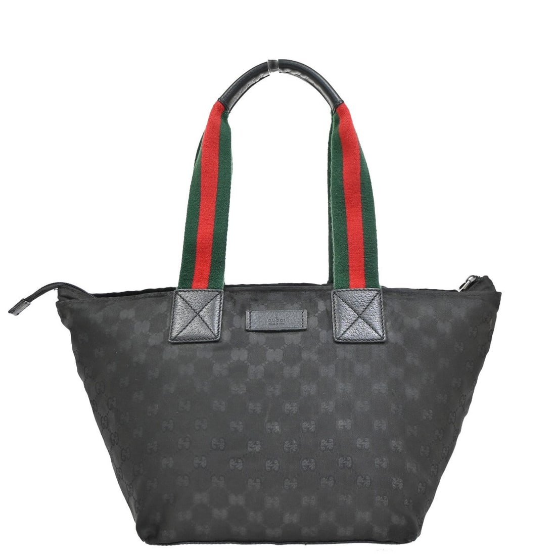 Web Stripe Black Shoulder Bag by Gucci: Web Stripe Black Shoulder Bag by Gucci This pre-owned Gucci Web Zip Tote in black is a shoulder bag designed for women. It is in good condition with visible signs of use, including scuffs, dirt, stain