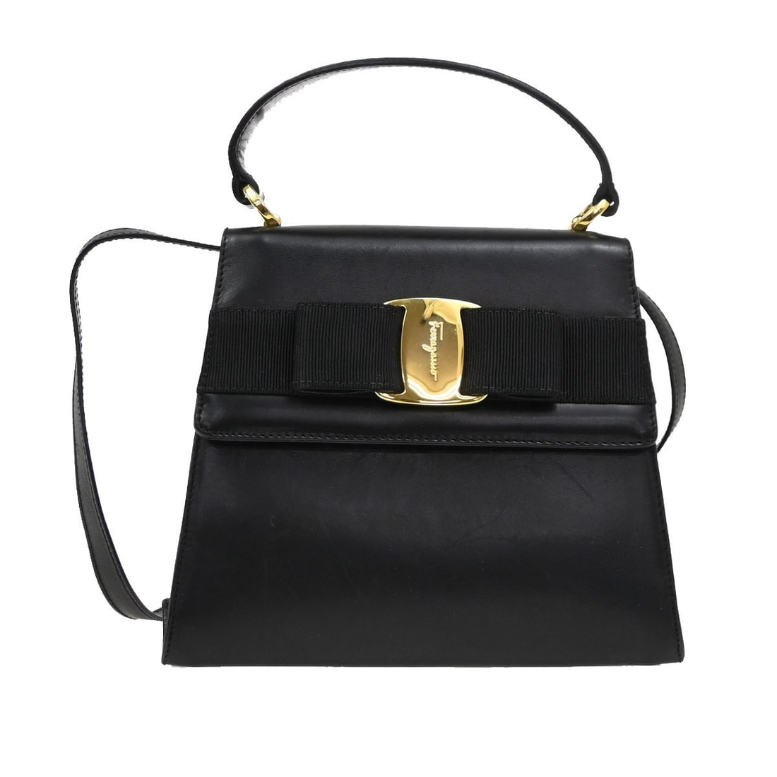 Vintage Vara Bow Black Top Handle Shoulder Bag by Salvatore Ferragamo: Vintage Vara Bow Black Top Handle Shoulder Bag by Salvatore Ferragamo This vintage Salvatore Ferragamo Vara Bow top handle shoulder bag features black leather with signature bow detailing. The bag sho