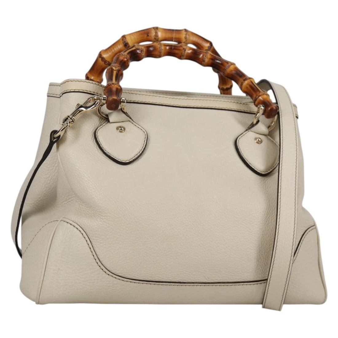 White Diana Bamboo Handle Tote Bag by Gucci: White Diana Bamboo Handle Tote Bag by Gucci This pre-owned Gucci Diana Bamboo Top Handle Tote features a white exterior and classic bamboo handles. The handbag is in good condition with slight rubbing