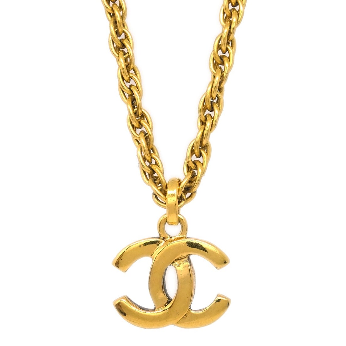 Chanel Gold-Plated CC Charm Pendant Necklace: Chanel Gold-Plated CC Charm Pendant Necklace This exquisite Chanel Gold CC Pendant Necklace features the iconic CC logo in a charming pendant design. Crafted from gold-plated metal, this necklace is a
