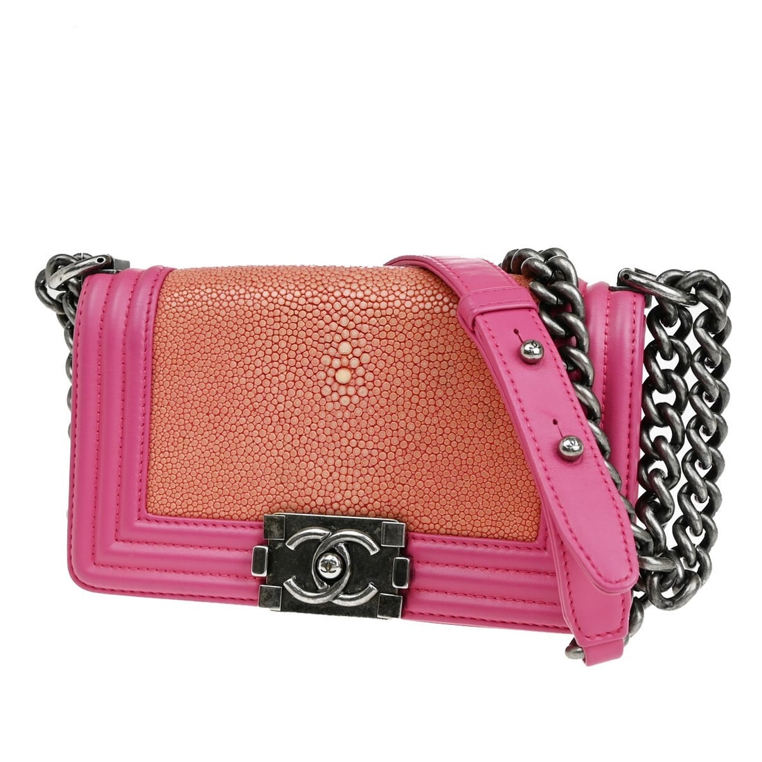 Pink Chanel Boy Shoulder Bag with Flap Closure: Pink Chanel Boy Shoulder Bag with Flap Closure This Chanel Boy Flap Bag is crafted for women in a striking pink color. Designed as a shoulder bag, it features a structured silhouette and offers both s