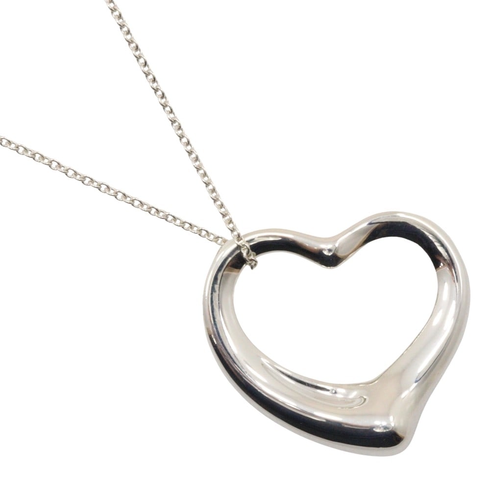 Elsa Peretti Open Heart Necklace in Silver by Tiffany & Co.: Elsa Peretti Open Heart Necklace in Silver by Tiffany & Co. This Tiffany & Co. Elsa Peretti Open Heart pendant necklace is crafted in silver and designed for women. The piece is in pristine condition,