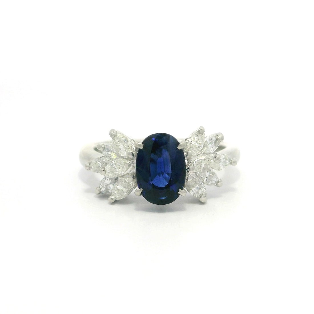 Platinum GIA 1.7ct Oval Blue Sapphire Diamond Cocktail Ring: Platinum GIA 1.7ct Oval Blue Sapphire Diamond Cocktail Ring This stunning cocktail ring features a captivating oval royal blue sapphire at its center, surrounded by twelve marquise-cut diamonds that e