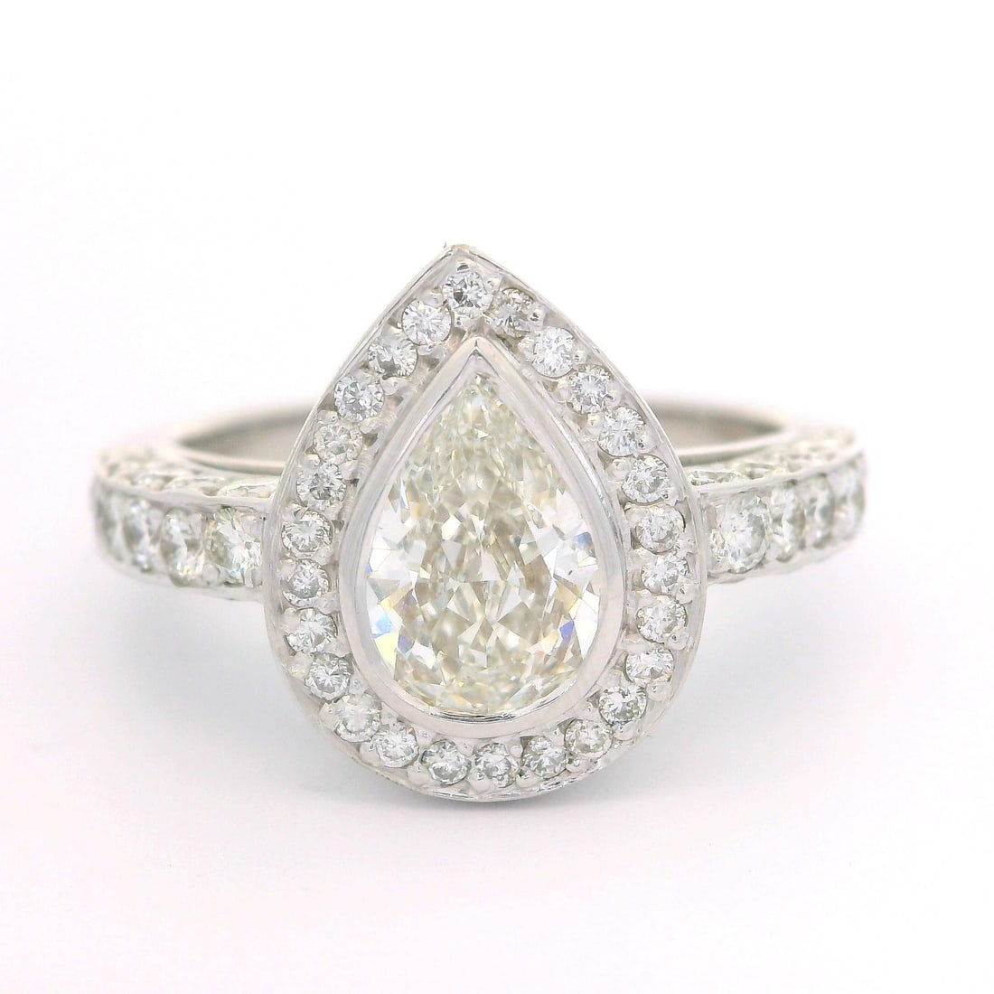 18k White Gold GIA Certified 1.89ctw Pear Cut Diamond Cocktail Ring: 18k White Gold GIA Certified 1.89ctw Pear Cut Diamond Cocktail Ring This exquisite cocktail ring features a stunning 1.89 carat total weight of diamonds, elegantly set in solid 18k white gold. The cen