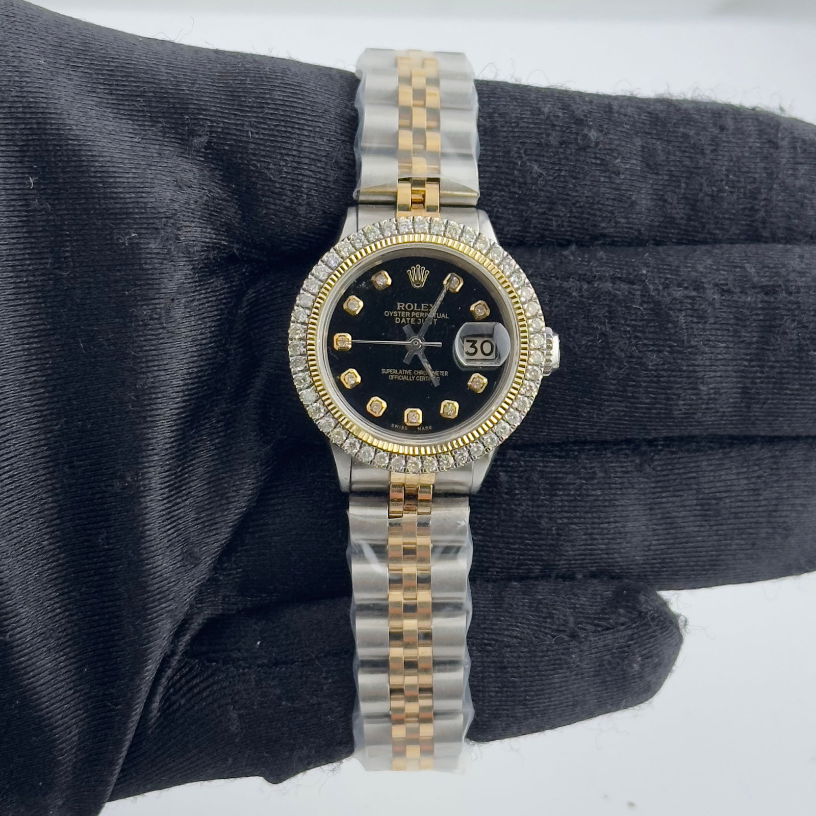 Ladies Datejust Ref 6517 Aftermarket Black Diamond Dial Jubilee Bracelet Watch: Ladies Datejust Ref 6517 Aftermarket Black Diamond Dial Jubilee Bracelet Watch This ladies' Rolex Datejust features an aftermarket black diamond dial and an aftermarket Jubilee bracelet with a hidden