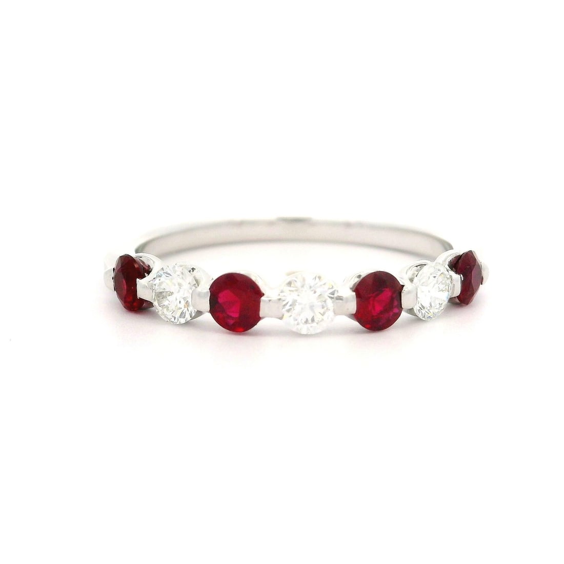 Platinum 1.12ctw Ruby Diamond Band Ring Size 10: Platinum 1.12ctw Ruby Diamond Band Ring Size 10 This exquisite low profile band ring showcases a stunning combination of alternating natural rubies and diamonds set in solid platinum. The design featu