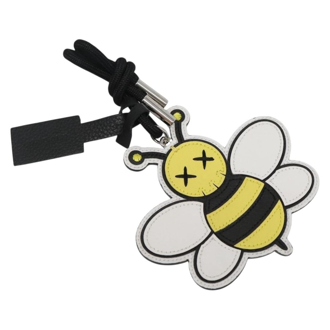 Christian Dior KAWS Yellow Leather Charm Made in Italy: Christian Dior KAWS Yellow Leather Charm Made in Italy This exquisite Christian Dior x KAWS Charm is crafted from high-quality leather in a vibrant yellow color, perfect for adding a pop of brightness