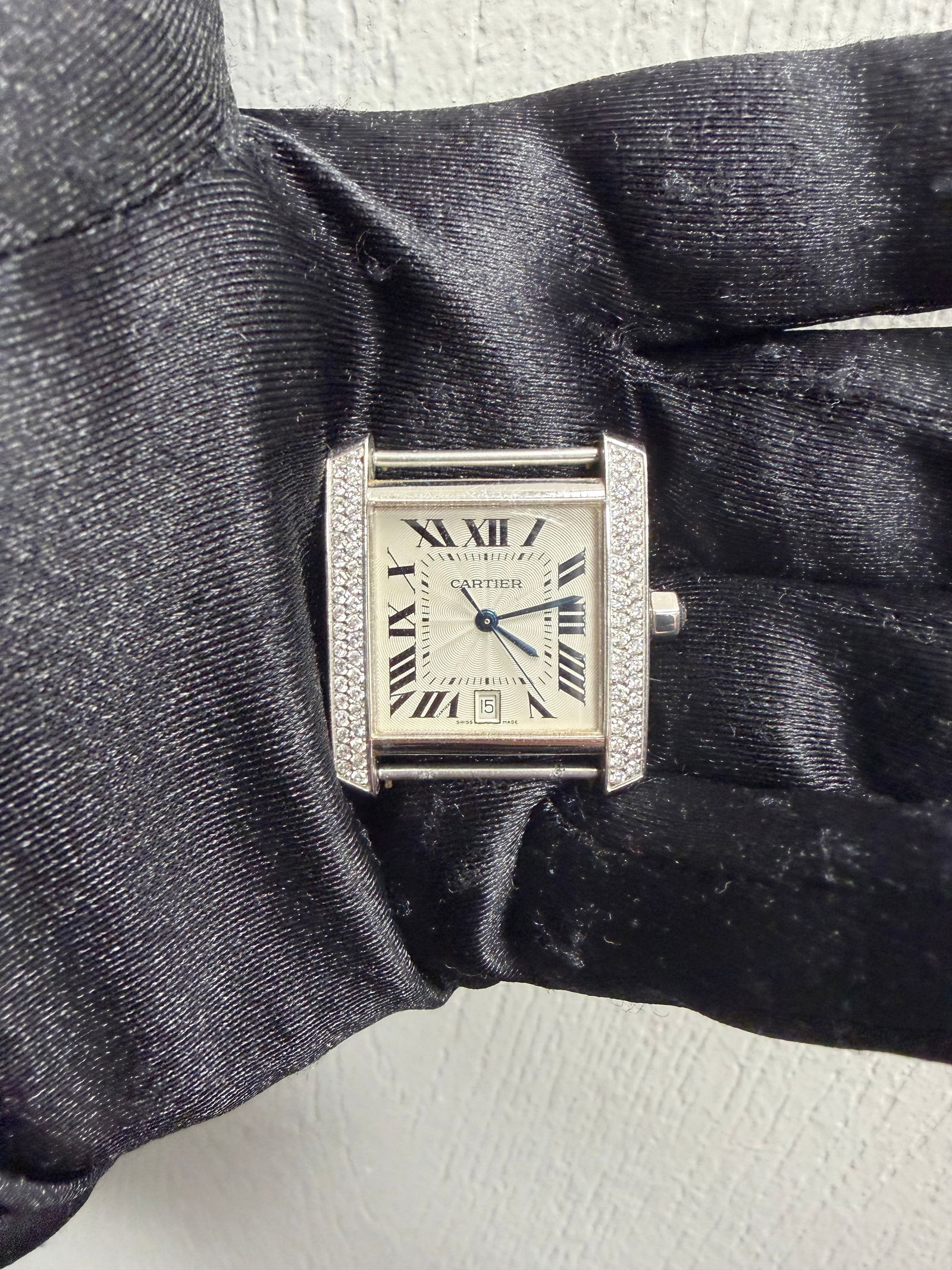 18k White Gold Cartier Tank Watch Reference 2366: 18k White Gold Cartier Tank Watch Reference 2366 This Cartier Tank watch features a white dial and is crafted from 18k white gold. It has a total carat weight of 1.00 ct. The watch is in good conditio