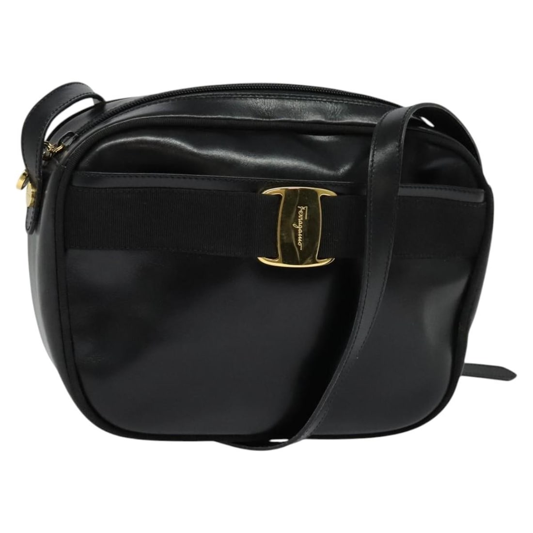 Black Vala Shoulder Bag by Salvatore Ferragamo: Black Vala Shoulder Bag by Salvatore Ferragamo This Salvatore Ferragamo Vala shoulder bag is crafted in black and designed for female use. The exterior shows some loss of shape and rubbing, with minor
