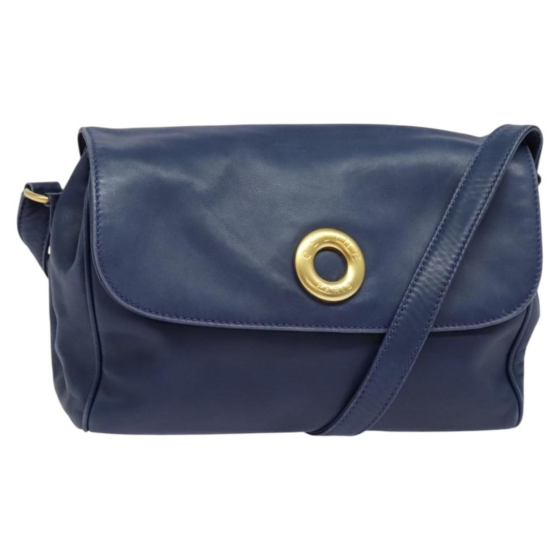 Celine Navy Shoulder Bag with Circle Logo Design: Celine Navy Shoulder Bag with Circle Logo Design This Celine shoulder bag features a navy exterior with the iconic circle logo. The bag shows signs of use, including out-of-shape areas, rubbing, scrat