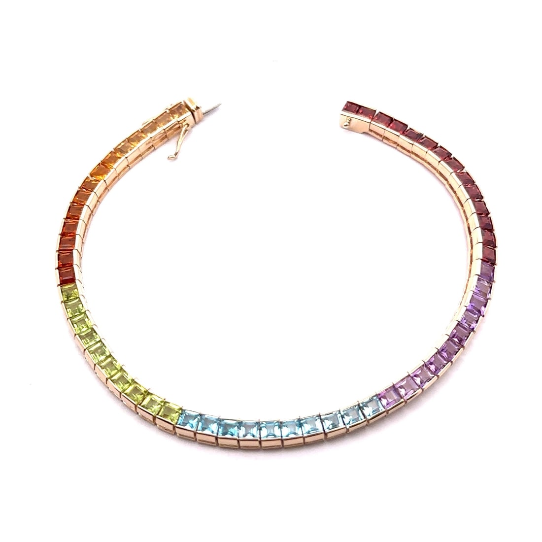 14k Yellow Gold Multicolor Square Step Cut Bracelet 7in: 14k Yellow Gold Multicolor Square Step Cut Bracelet 7in This stunning 14k Yellow Gold bracelet features a vibrant gradient of genuine, square step cut stones. The bracelet showcases an array of colors